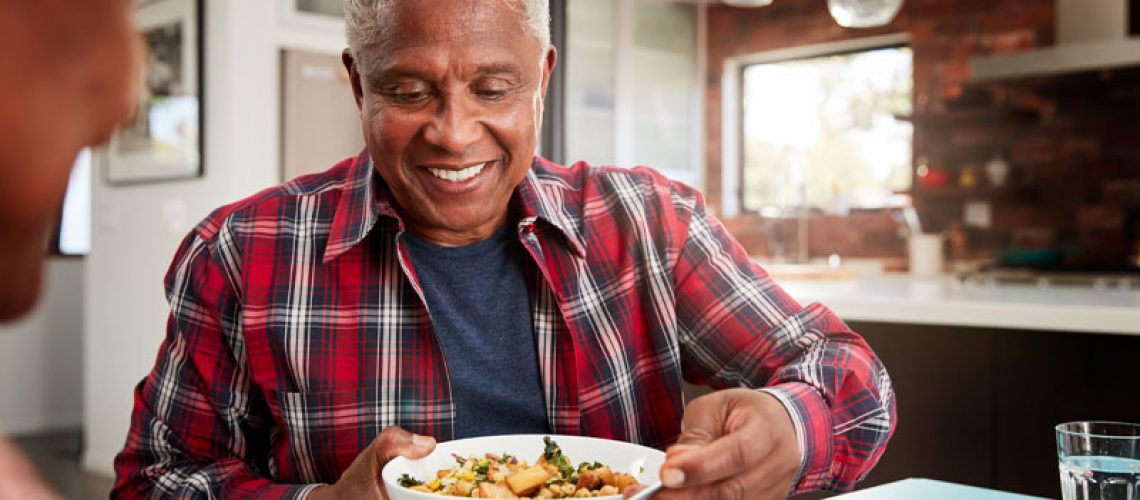 a dental implants patient eating